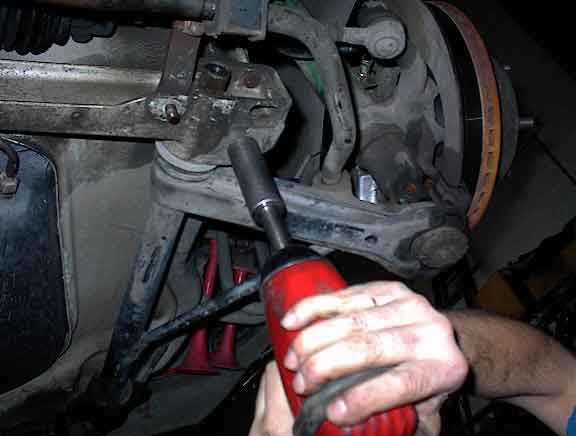 removing rear trailing arm bolt